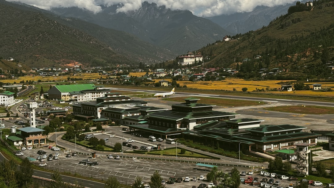 Paro International Airport in its Himalayan valley, with an aircraft on the runway