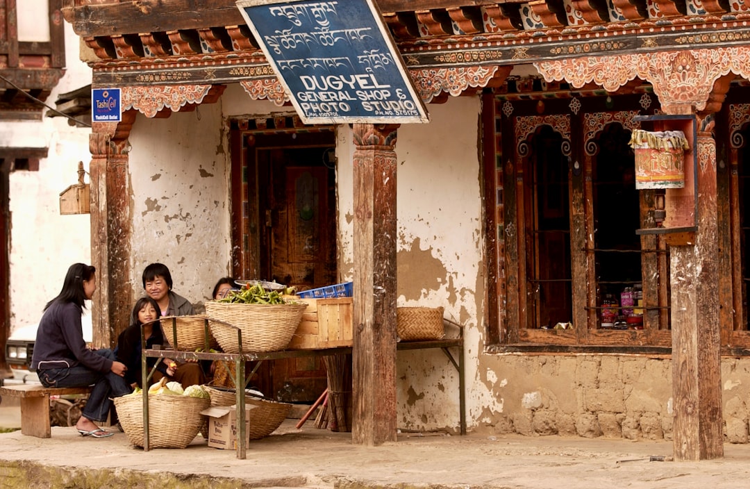 A Bhutanese market town street where cash still matters