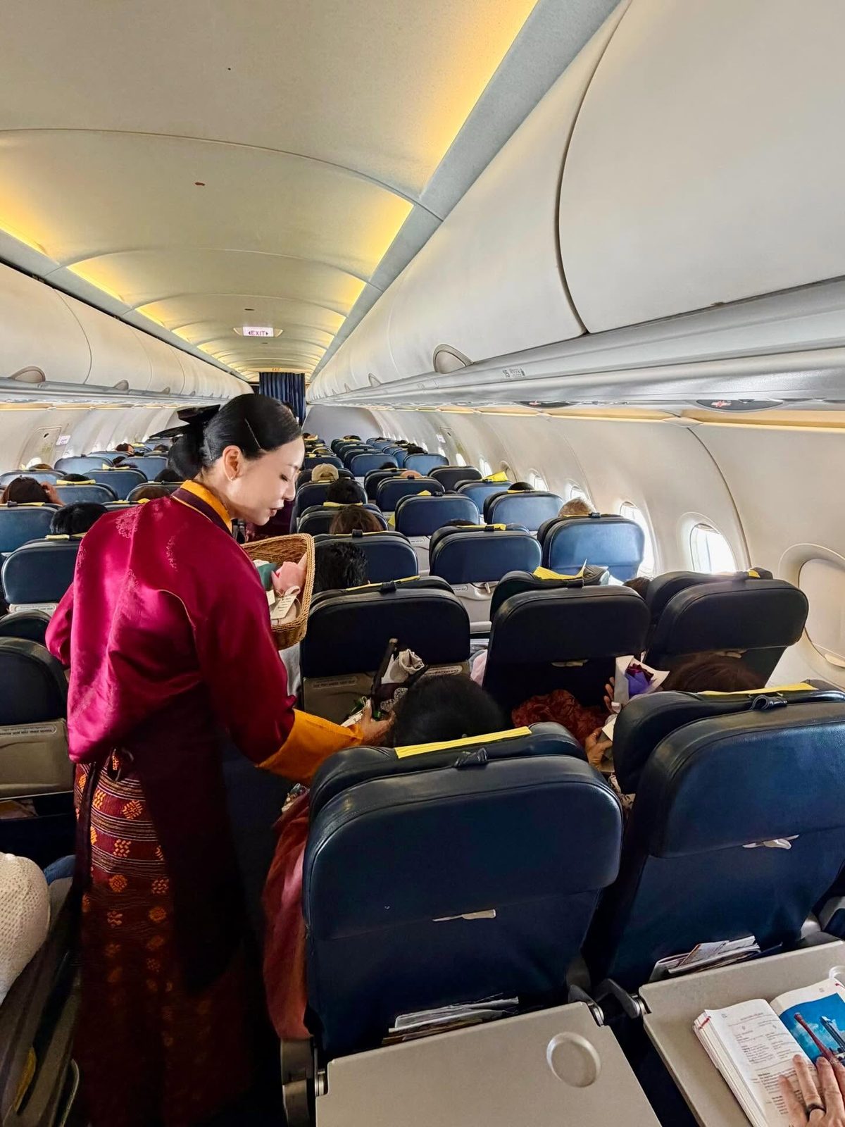 Bhutan Airlines cabin crew serving guests