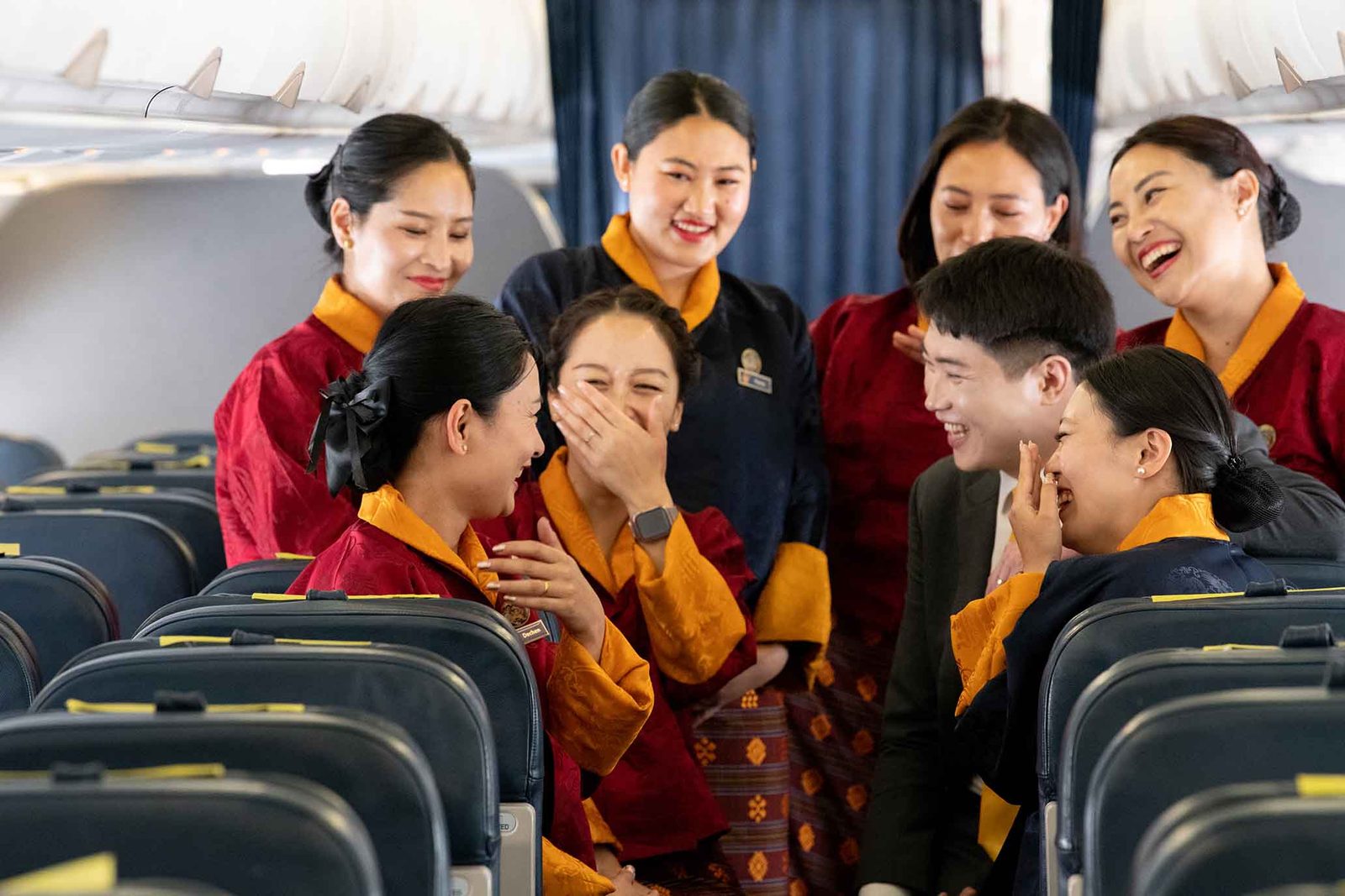Bhutan Airlines cabin crew sharing a joyful moment on board