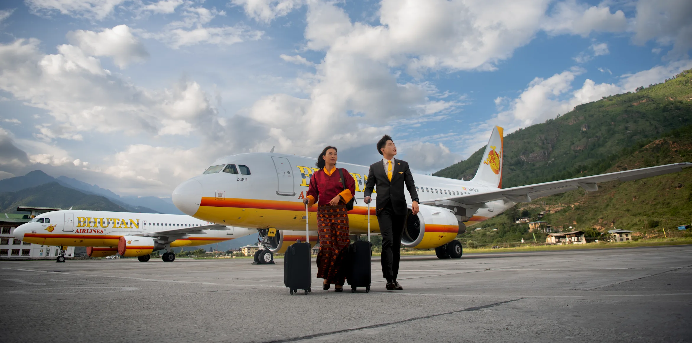 Bhutan Airlines cabin crew welcoming guests