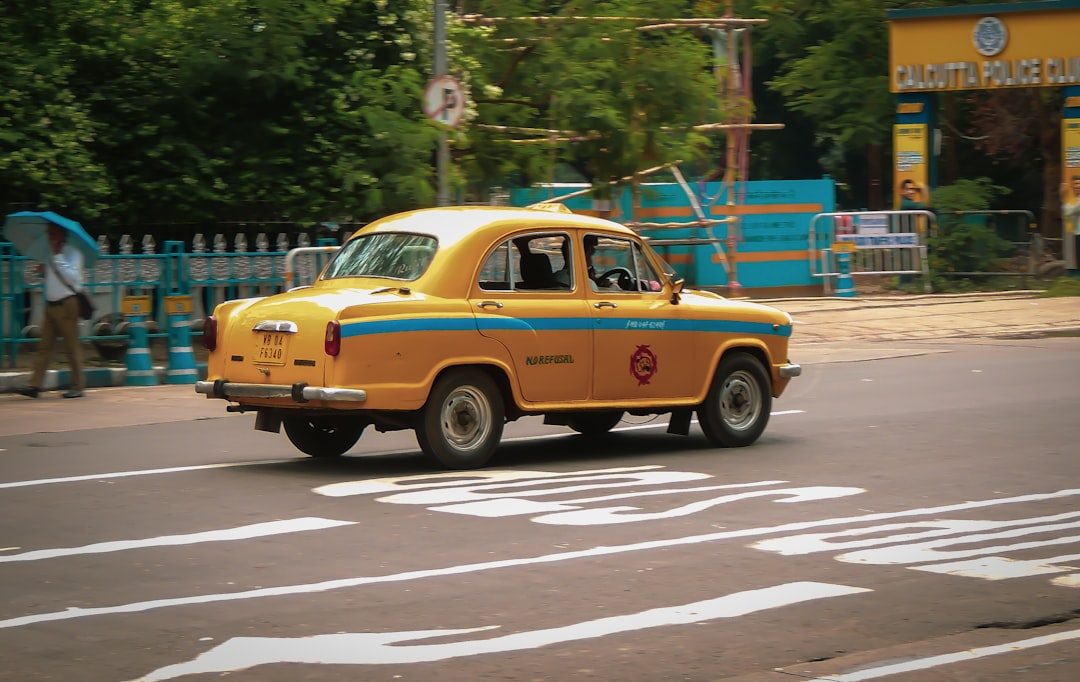 Iconic yellow taxi on a Kolkata street