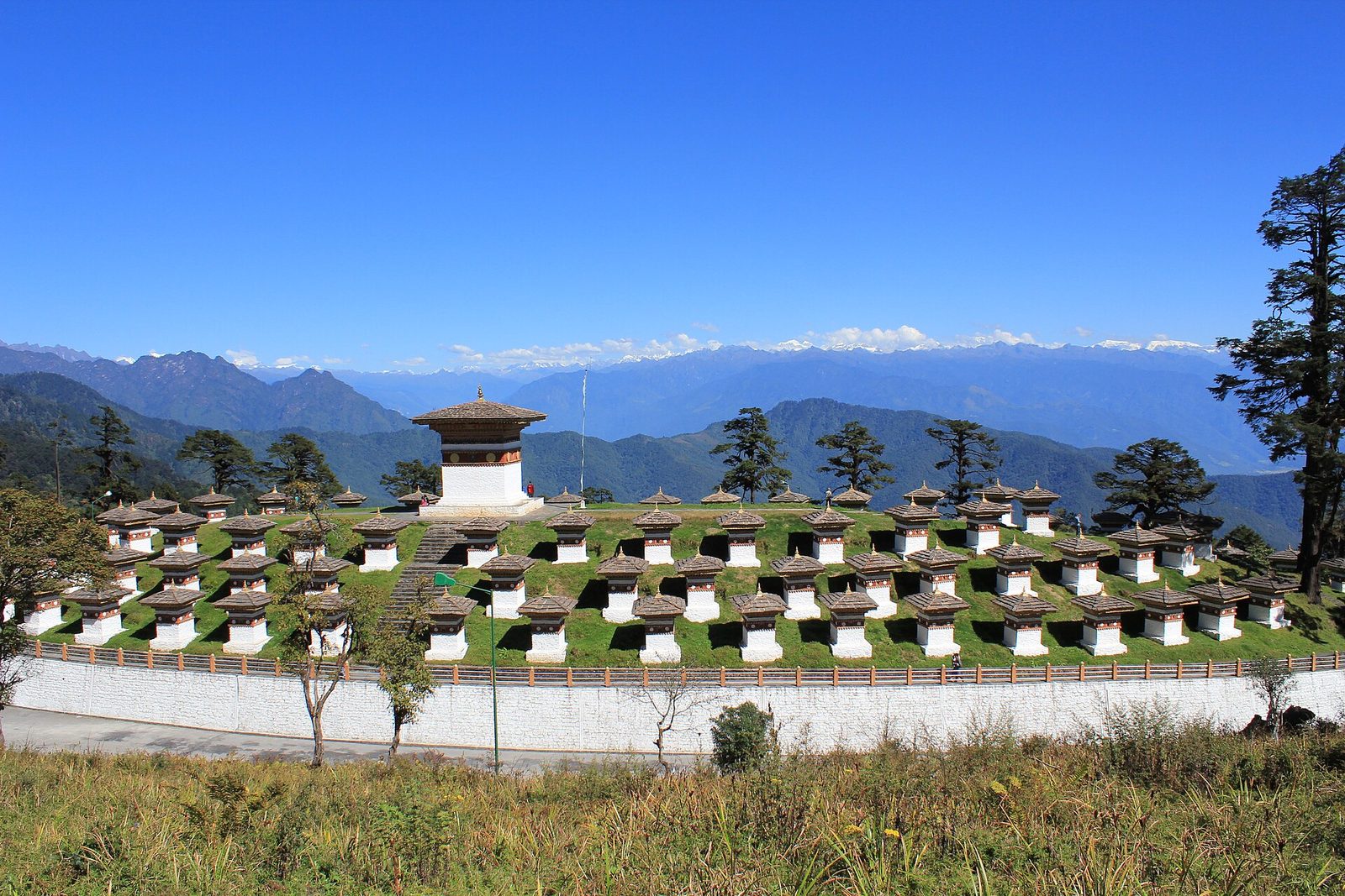 The 108 Druk Wangyal chortens at Dochula Pass with Himalayan peaks behind
